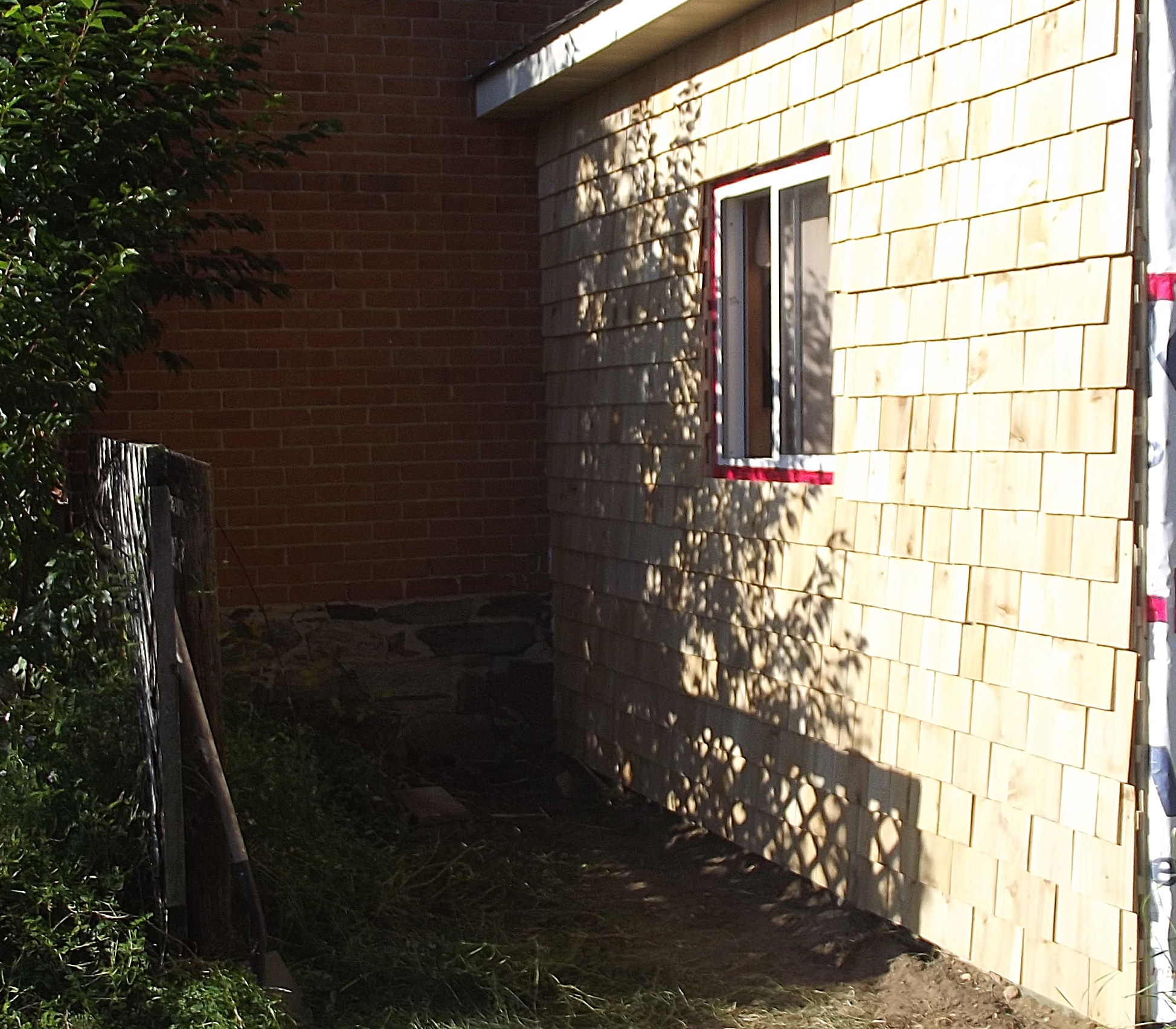 Cedar shingle wall panels installed